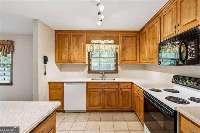 2270 Dinsmore Rd, Alpharetta, GA 30004 - kitchen featuring electric range oven, dishwasher, black microwave, a sink, and brown cabinetry