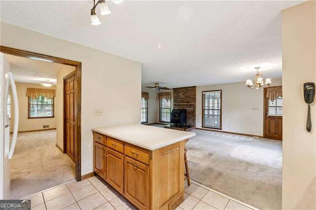 2270 Dinsmore Rd, Alpharetta, GA 30004 - kitchen with light carpet, light tile patterned floors, and plenty of natural light