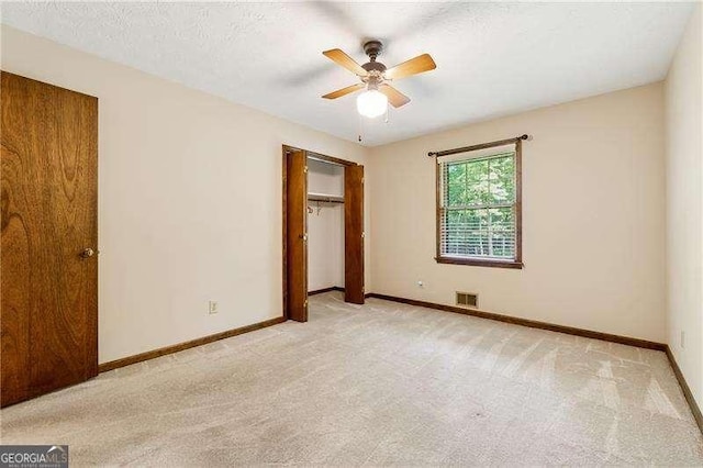 2270 Dinsmore Rd, Alpharetta, GA 30004 - unfurnished bedroom with light colored carpet, baseboards, a closet, and a ceiling fan
