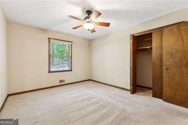 2270 Dinsmore Rd, Alpharetta, GA 30004 - unfurnished bedroom featuring light carpet, a closet, baseboards, ceiling fan, and a textured ceiling
