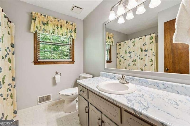 2270 Dinsmore Rd, Alpharetta, GA 30004 - bathroom featuring vanity, toilet, baseboards, tile patterned flooring, and curtained shower