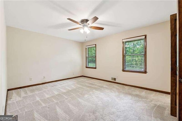 2270 Dinsmore Rd, Alpharetta, GA 30004 - empty room with ceiling fan, light colored carpet, and baseboards
