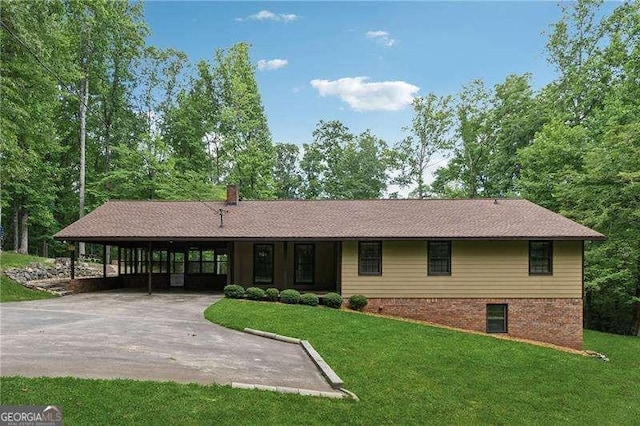2270 Dinsmore Rd, Alpharetta, GA 30004 - view of front of home featuring a front lawn, concrete driveway, and a carport