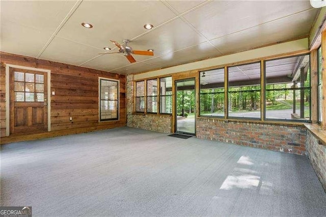 2270 Dinsmore Rd, Alpharetta, GA 30004 - unfurnished sunroom featuring wooden walls and brick wall