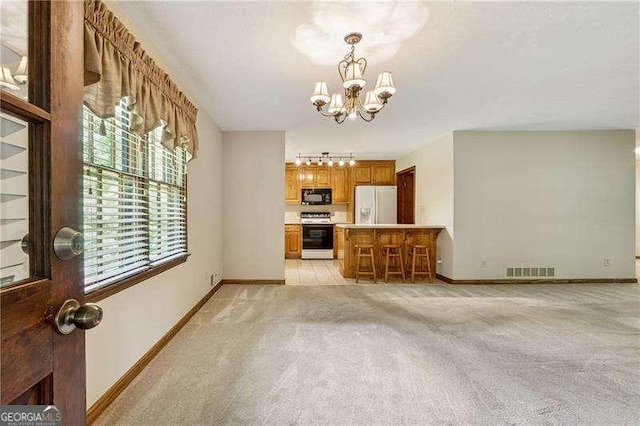 2270 Dinsmore Rd, Alpharetta, GA 30004 - unfurnished living room featuring a chandelier, light carpet, and baseboards