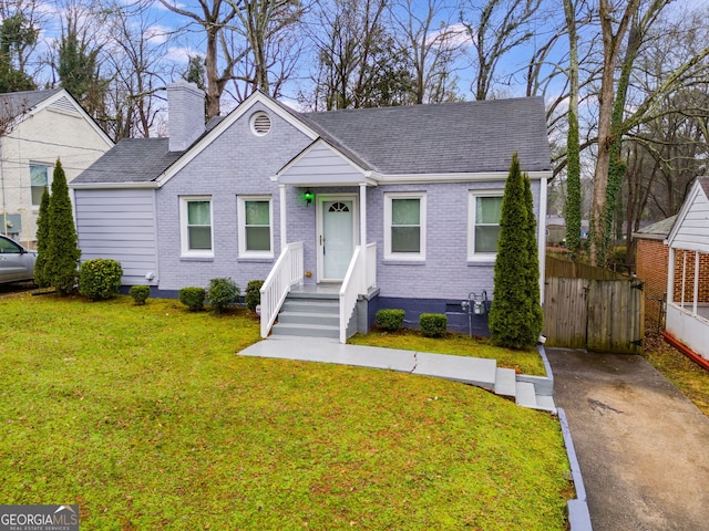 1318 Beecher St SW, Atlanta, GA 30310 - view of front facade featuring a chimney, brick siding, and roof with shingles