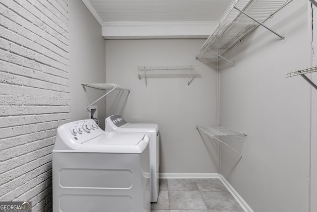 1318 Beecher St SW, Atlanta, GA 30310 - washroom with washer and clothes dryer, ornamental molding, baseboards, and light tile patterned floors