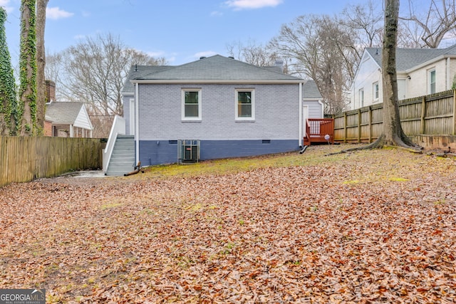 1318 Beecher St SW, Atlanta, GA 30310 - rear view of property with brick siding, a fenced backyard, crawl space, cooling unit, and a shingled roof