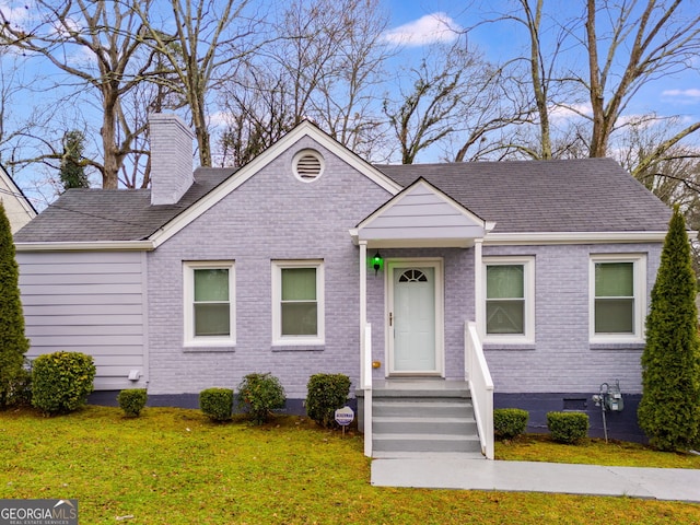 1318 Beecher St SW, Atlanta, GA 30310 - view of front of home with brick siding, a chimney, and a front yard