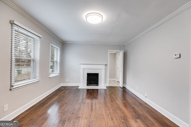 1318 Beecher St SW, Atlanta, GA 30310 - unfurnished living room featuring wood finished floors, crown molding, a fireplace, and baseboards
