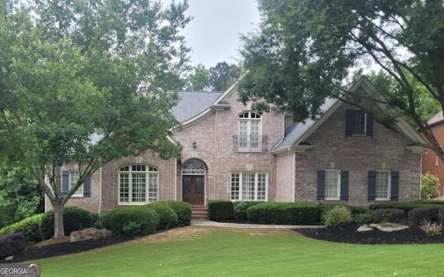 415 Winn Park Ct, Roswell, GA 30075 - view of front of house featuring french doors, a front yard, and brick siding