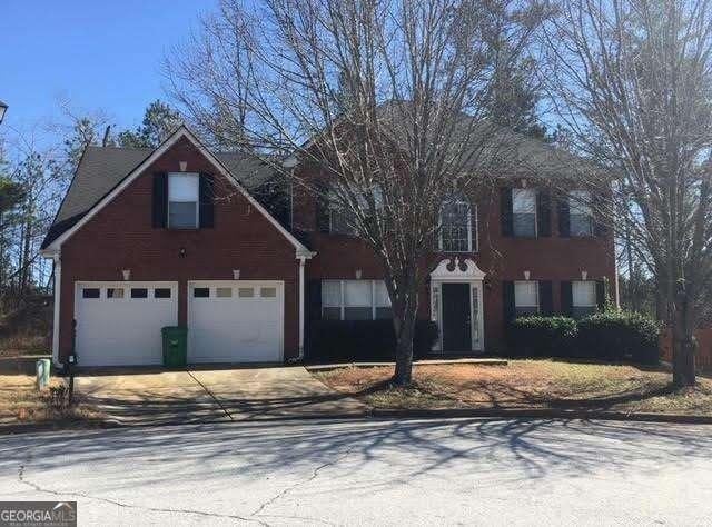 5755 Belmont Ridge Cir, Lithonia, GA 30038 - colonial home featuring driveway and a garage