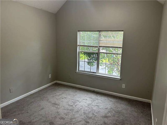 5755 Belmont Ridge Cir, Lithonia, GA 30038 - spare room with carpet flooring and vaulted ceiling