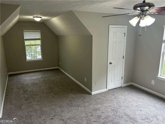 5755 Belmont Ridge Cir, Lithonia, GA 30038 - bonus room with a textured ceiling, carpet, healthy amount of natural light, ceiling fan, and lofted ceiling