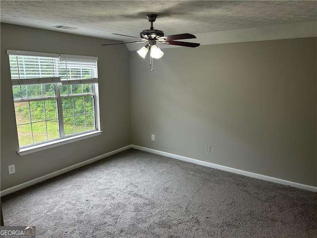 5755 Belmont Ridge Cir, Lithonia, GA 30038 - spare room featuring a textured ceiling, carpet floors, and ceiling fan