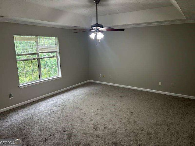 5755 Belmont Ridge Cir, Lithonia, GA 30038 - spare room featuring a ceiling fan, carpet floors, a tray ceiling, and crown molding