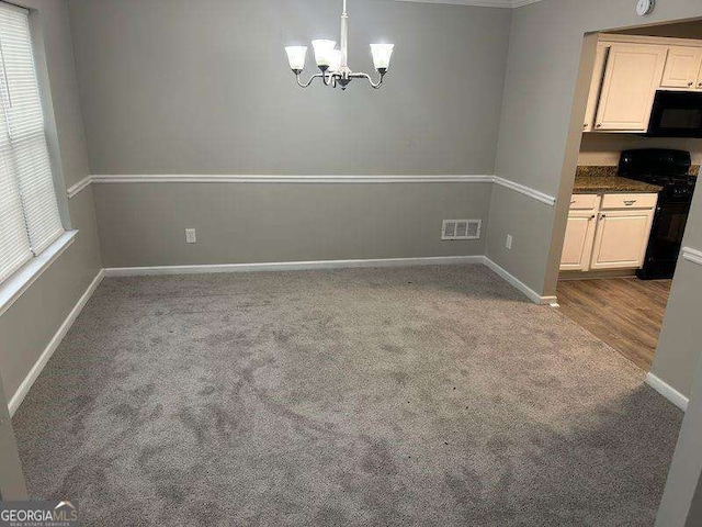 5755 Belmont Ridge Cir, Lithonia, GA 30038 - unfurnished dining area with a chandelier, carpet floors, and plenty of natural light