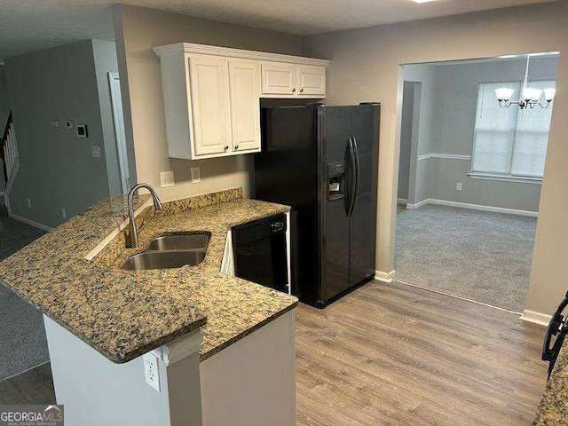 5755 Belmont Ridge Cir, Lithonia, GA 30038 - kitchen featuring dishwasher, black fridge with ice dispenser, white cabinetry, a peninsula, and stone countertops