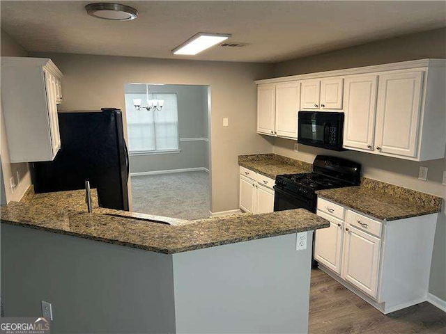 5755 Belmont Ridge Cir, Lithonia, GA 30038 - kitchen featuring black appliances, a chandelier, white cabinets, and dark stone countertops