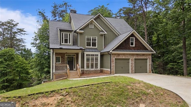 109 Sitting Bull Ct, Waleska, GA 30183 - craftsman house featuring driveway, a front yard, a shingled roof, covered porch, and an attached garage
