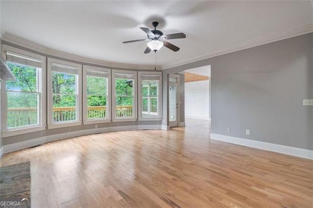 109 Sitting Bull Ct, Waleska, GA 30183 - unfurnished room featuring ornamental molding, baseboards, ceiling fan, and light wood-style flooring
