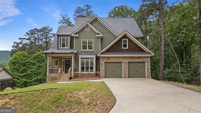 109 Sitting Bull Ct, Waleska, GA 30183 - craftsman-style home with concrete driveway, covered porch, board and batten siding, a garage, and a front lawn