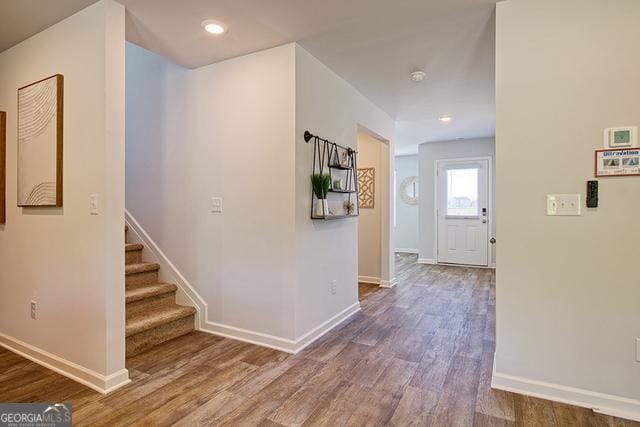 306 Cody Dr, Macon, GA 31216 - hall featuring wood finished floors, baseboards, stairway, and recessed lighting