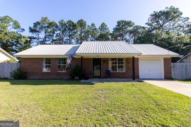 128 Deann Dr, Hinesville, GA 31313 - single story home featuring a garage, driveway, brick siding, a porch, and metal roof