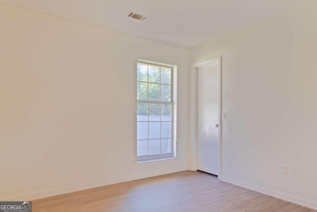 128 Deann Dr, Hinesville, GA 31313 - empty room featuring light wood-type flooring and baseboards