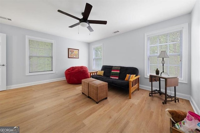 68 Edwin Pl, Atlanta, GA 30318 - living area with light wood-style floors, ceiling fan, and baseboards
