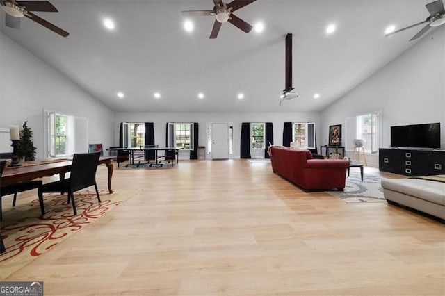 68 Edwin Pl, Atlanta, GA 30318 - living room with a ceiling fan, high vaulted ceiling, plenty of natural light, light wood finished floors, and recessed lighting