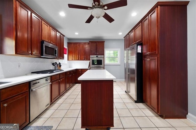 68 Edwin Pl, Atlanta, GA 30318 - kitchen featuring appliances with stainless steel finishes, a ceiling fan, a center island, light countertops, and recessed lighting