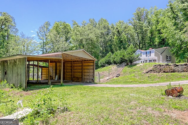 218 Jefferson Pl, Toccoa, GA 30577 - view of yard featuring a pole building, a carport, and an outbuilding