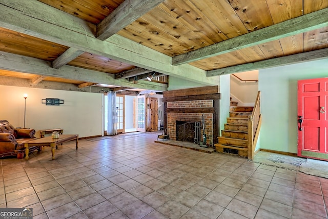218 Jefferson Pl, Toccoa, GA 30577 - tiled living area with wooden ceiling with exposed beams, stairs, baseboards, and a brick fireplace