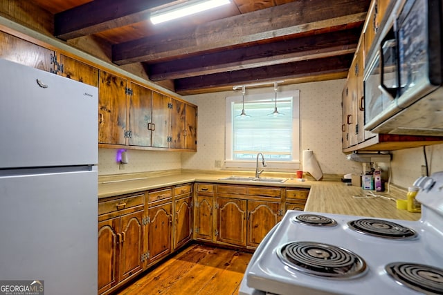 218 Jefferson Pl, Toccoa, GA 30577 - kitchen with white appliances, a sink, beam ceiling, light countertops, and brown cabinetry