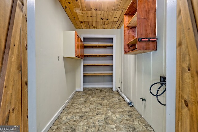 218 Jefferson Pl, Toccoa, GA 30577 - hall featuring wooden ceiling, stone finish flooring, and baseboards
