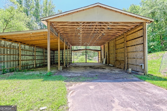 218 Jefferson Pl, Toccoa, GA 30577 - view of parking / parking lot with asphalt driveway, an exterior structure, and a carport