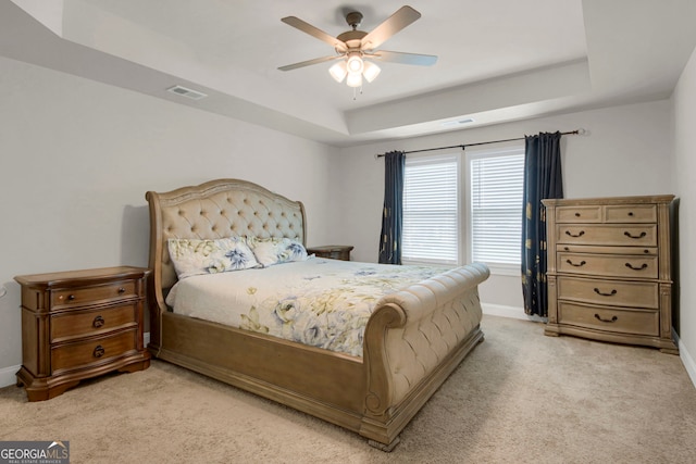 340 Mcgiboney Ln, Covington, GA 30016 - bedroom with a tray ceiling, light colored carpet, and ceiling fan