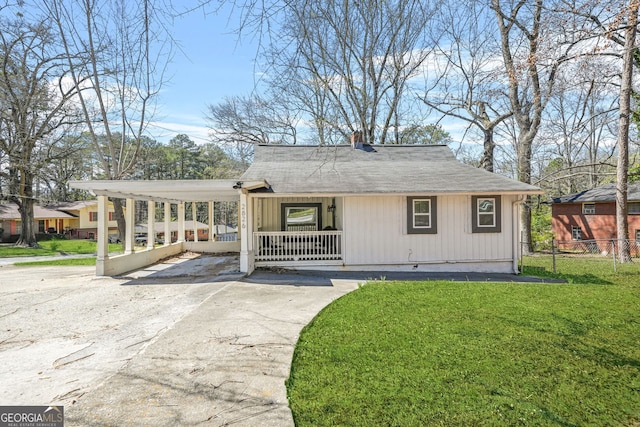 2826 Ben Hill Rd, East Point, GA 30344 - view of front of property featuring covered porch, driveway, a chimney, and roof with shingles
