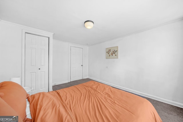2826 Ben Hill Rd, East Point, GA 30344 - bedroom featuring carpet floors, baseboards, and a closet
