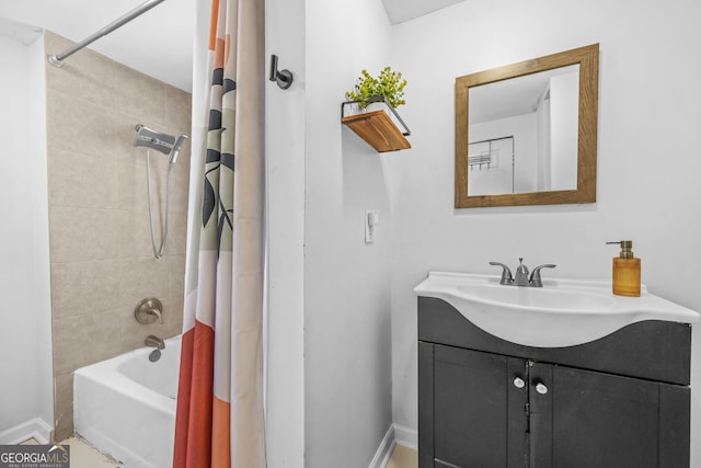 2826 Ben Hill Rd, East Point, GA 30344 - bathroom featuring vanity, shower / bath combo, and baseboards