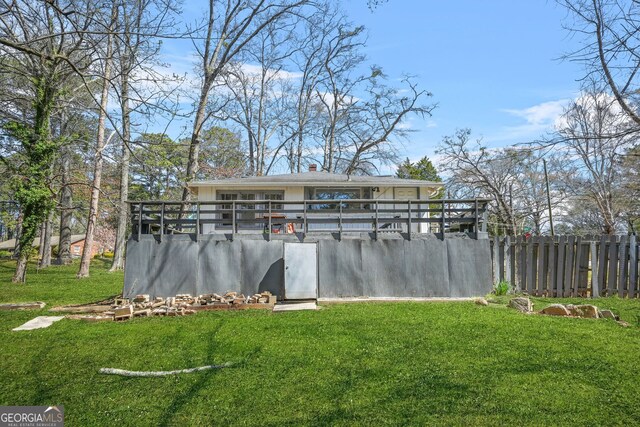 2826 Ben Hill Rd, East Point, GA 30344 - rear view of house featuring a lawn and a chimney