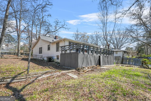2826 Ben Hill Rd, East Point, GA 30344 - view of property exterior featuring central AC and a chimney