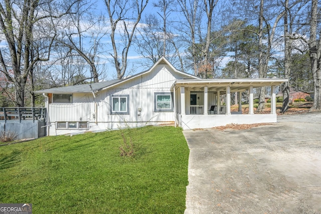 2826 Ben Hill Rd, East Point, GA 30344 - view of front of home featuring covered porch, a front yard, and board and batten siding