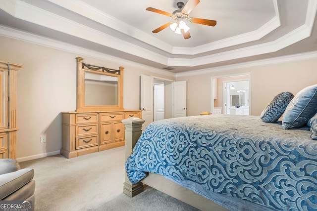1898 Alcovy Shoals Blf SE, Lawrenceville, GA 30045 - carpeted bedroom with ornamental molding, a raised ceiling, ensuite bath, baseboards, and a ceiling fan