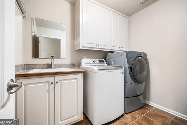 1898 Alcovy Shoals Blf SE, Lawrenceville, GA 30045 - washroom with cabinet space, washer and dryer, and baseboards