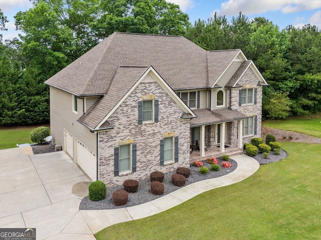 1898 Alcovy Shoals Blf SE, Lawrenceville, GA 30045 - view of front of property with an attached garage, roof with shingles, concrete driveway, and a front lawn