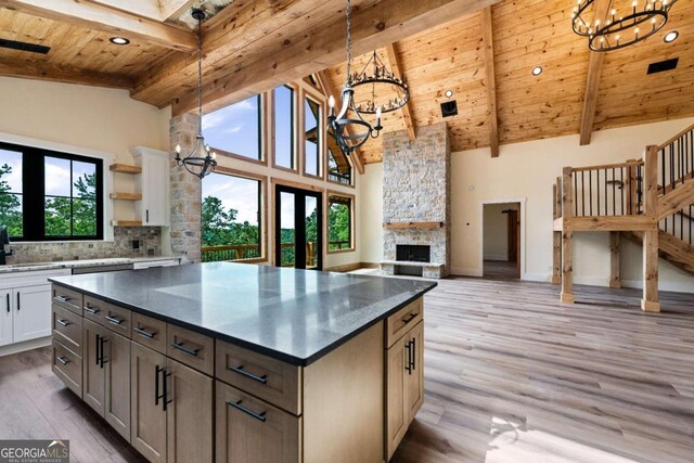458 Palisade Dr Unit 2142, Ellijay, GA 30540 - kitchen with a chandelier, wood ceiling with exposed beams, high vaulted ceiling, open shelves, and a stone fireplace