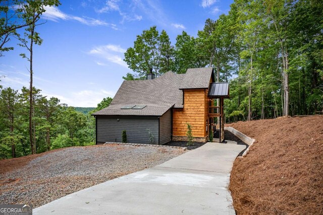 458 Palisade Dr Unit 2142, Ellijay, GA 30540 - view of side of property with roof with shingles, a standing seam roof, and a chimney