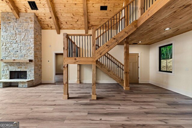 458 Palisade Dr Unit 2142, Ellijay, GA 30540 - unfurnished living room with wood ceiling with exposed beams, stairway, wood finished floors, baseboards, and high vaulted ceiling
